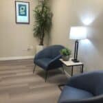Office interior at the Gallus Detox Center in Denver with comfortable chairs in a clean, minimal waiting room