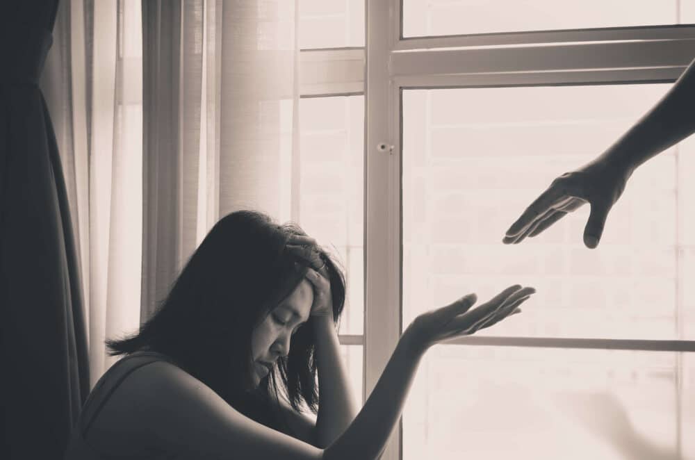 hand supporting someone going through detox