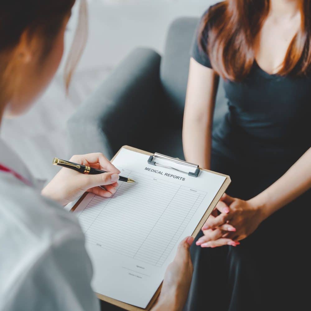 portrait of a female doctor She is recommending medications and treatment methods at the clinic.