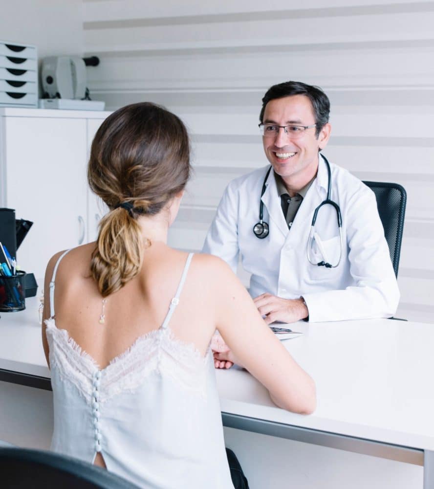 Male doctor with female patient